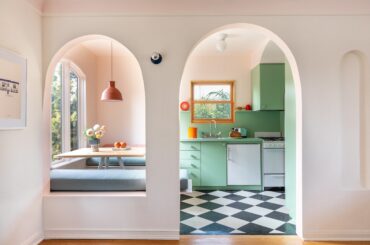 Arched entry to a mint green kitchen with banquette seating, Echo Park, Los Angeles [5027x3352]