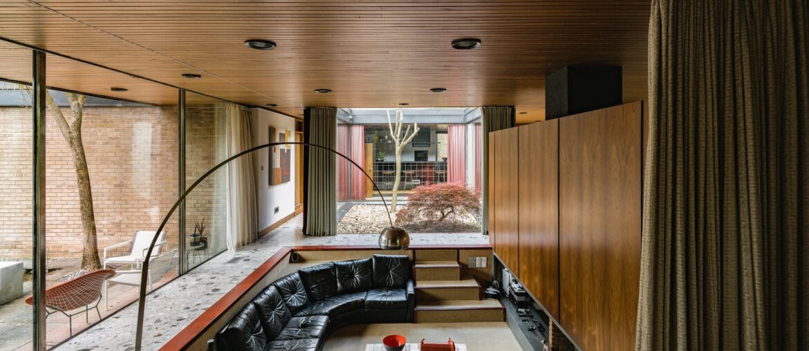 Sunken conversation pit in a modern residence with a courtyard garden designed by architect David Shelley in 1970, Nottinghamshire, East Midlands, England [2400x1500]