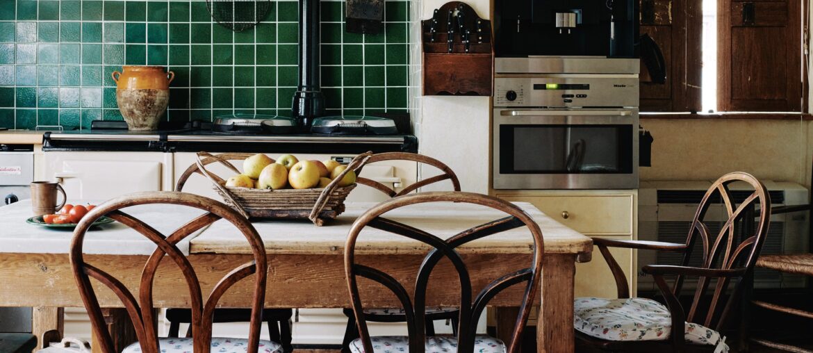Kitchen with reclaimed French terracotta floor tiles in a 17th-century house, Northamptonshire, East Midlands, England [3809x5000]