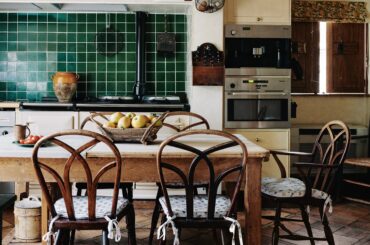 Kitchen with reclaimed French terracotta floor tiles in a 17th-century house, Northamptonshire, East Midlands, England [3809x5000]