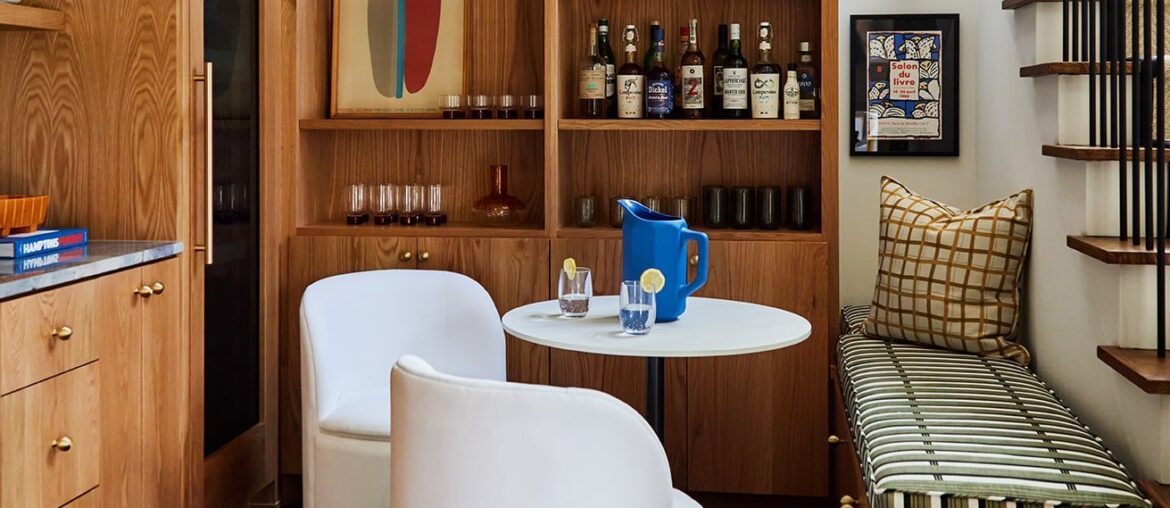 Bar space off the dining room with banquette seating in a renovated Nashville home, Tennessee [1311x1639]