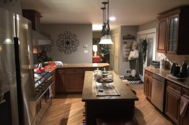 My kitchen during Christmas. 60in Viking range. Samsung refrigerator (biggest model they make) also pull out type drawer microwave in the island. Got the stove brand new for 8k on sale. Brand new 18k. I LOVE TO COOK. This remodel was all done myself.