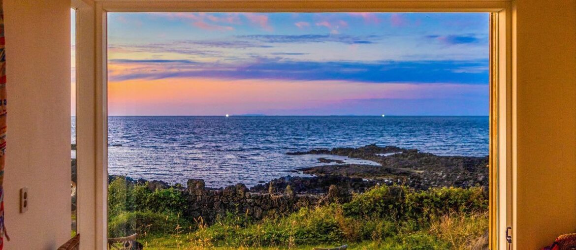 Ocean views framed by the window in a coastal cafe, Jeju City, Jeju Island, South Korea [1440×1800]