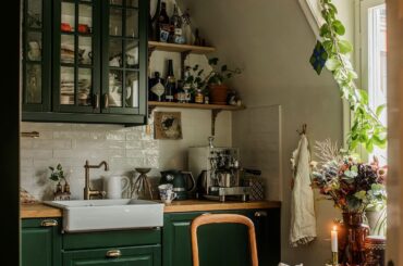 Compact kitchen with windows in an attic apartment, Södermalm, central Stockholm, Sweden [1378x2067]