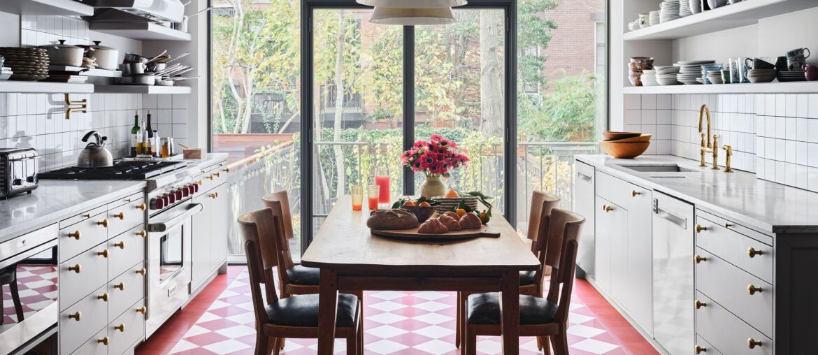 Kitchen with red-and-cream checkerboard floor and views of the neighborhood in a Gramercy Park townhouse, Manhattan, New York City [2500x1933]