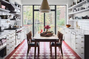 Kitchen with red-and-cream checkerboard floor and views of the neighborhood in a Gramercy Park townhouse, Manhattan, New York City [2500x1933]