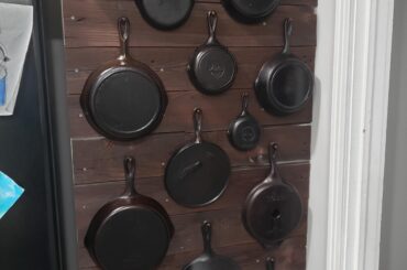 Cast iron pan wall-with old outhouse boards