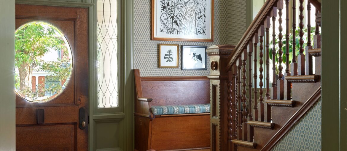 Entrance hall with original wood floors and moldings in a renovated Colorado home [6200x8272]