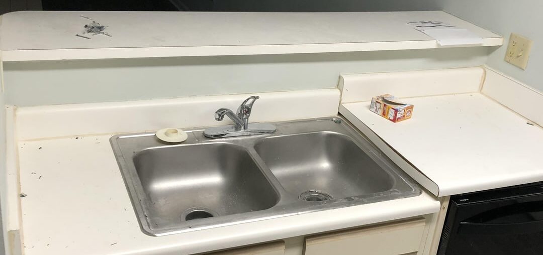 Ideas and rough estimates to replace this with decent countertops, cabinets, and single deep sink