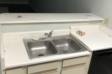 Ideas and rough estimates to replace this with decent countertops, cabinets, and single deep sink