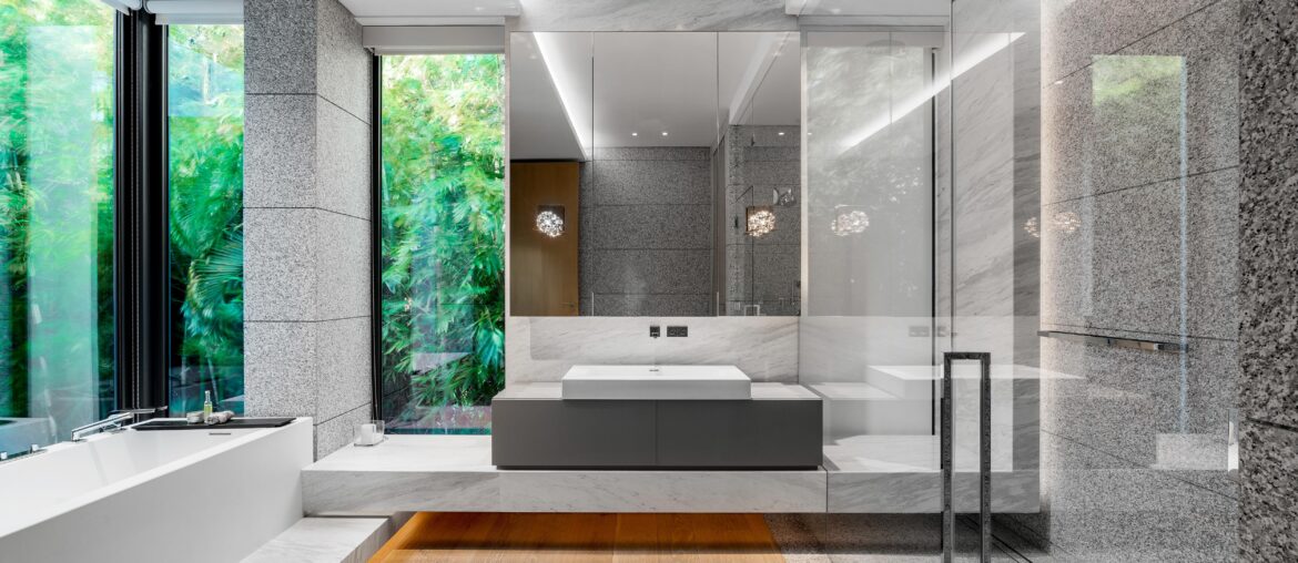 Gorgeous Bathroom with Floor to Ceiling Windows and Tub Surrounded by a Lush Tropical Landscape in Miami Beach, Florida [5000×3335]