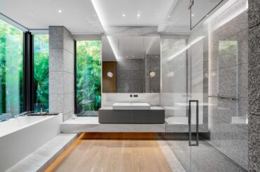 Gorgeous Bathroom with Floor to Ceiling Windows and Tub Surrounded by a Lush Tropical Landscape in Miami Beach, Florida [5000×3335]