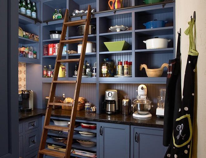 Kitchen with integrated open shelving pantry