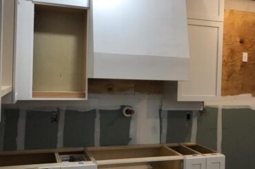 Our slide in rangetop is 8.5” tall but this base cabinet cut out is 11” tall - how would one adjust to keep the rangetop flush with or higher than the counter tops when installed?