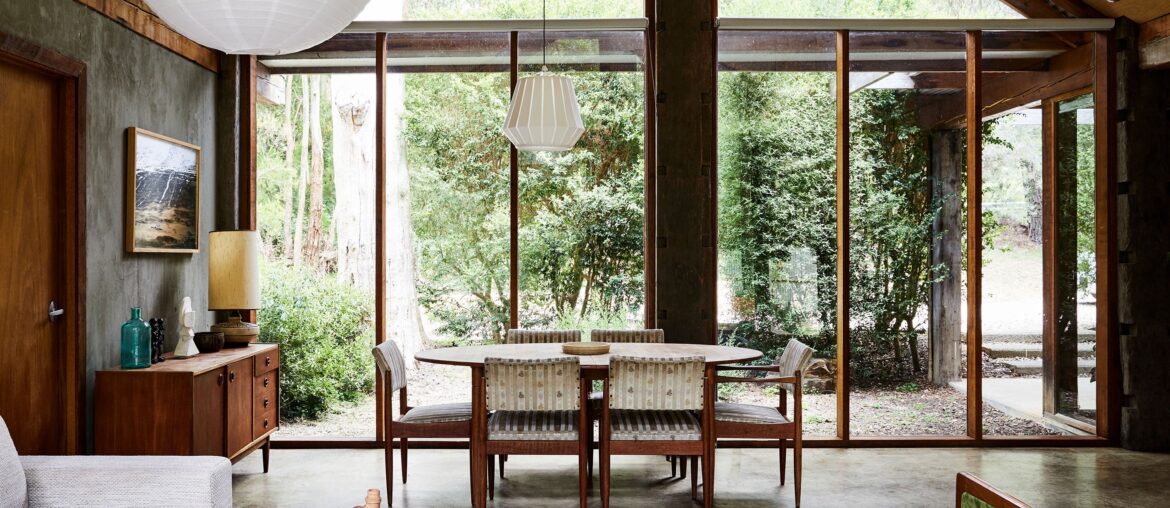 Dining space right next to floor-to-ceiling windows with views of the garden, Macedon, Victoria, Australia [2820x1800]