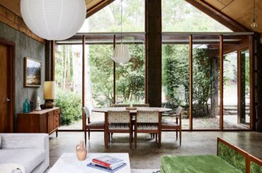 Dining space right next to floor-to-ceiling windows with views of the garden, Macedon, Victoria, Australia [2820x1800]