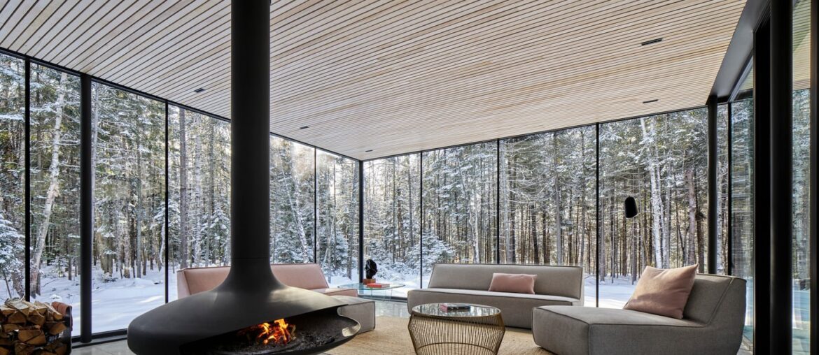 Glass walled living room in Apple Tree House [1418 x 1000] Montreal, Canada