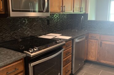 Someone help me decide what color we should switch the cabinets to. I really like the backsplash and countertops.