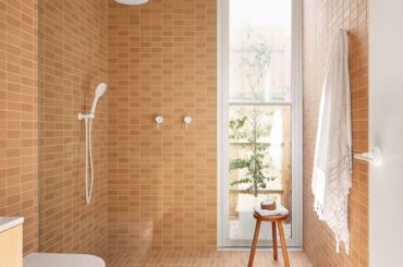 Tiled bathroom with a full-height glazed window in a renovated home, Northcote, Melbourne, Victoria, Australia [1920x2880]