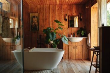 Timber-lined bathroom with a view in a lakeside cabin, Norfolk, East Anglia, England [2000x3000]