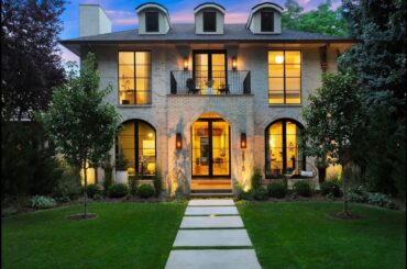 Modern elegance abounds in this French Provincial inspired residence