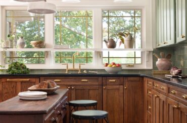 Sage and dark stained cabinetry kitchen in a remodeled 120-year-old craftsman, downtown Bentonville, Benton County, Arkansas [1390x2085]