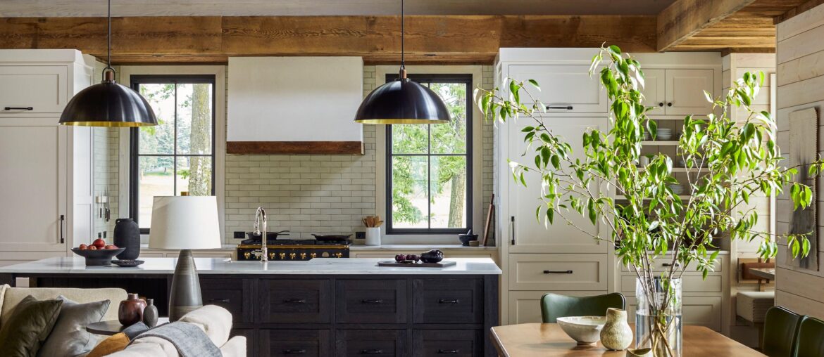 Double-height living and dining area with exposed rafters in a rustic Bigfork home, Flathead County, Montana [3600x5400]