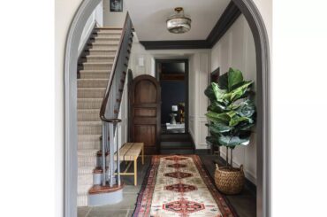 Arched entrance in a renovated 1960s residence with original wood trim and door casings, Glen Ellyn, DuPage County, Illinois [2400x2400]