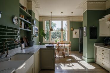Green kitchen and dining space in a renovated Victorian townhouse, Clapham, Lambeth, southwest London, UK [2400x1600]