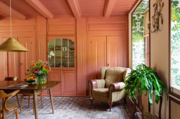 Dining space with terracotta floors in a renovated 1750s two-bedroom house, Walcheren, Zeeland, the Netherlands [2190x1460]