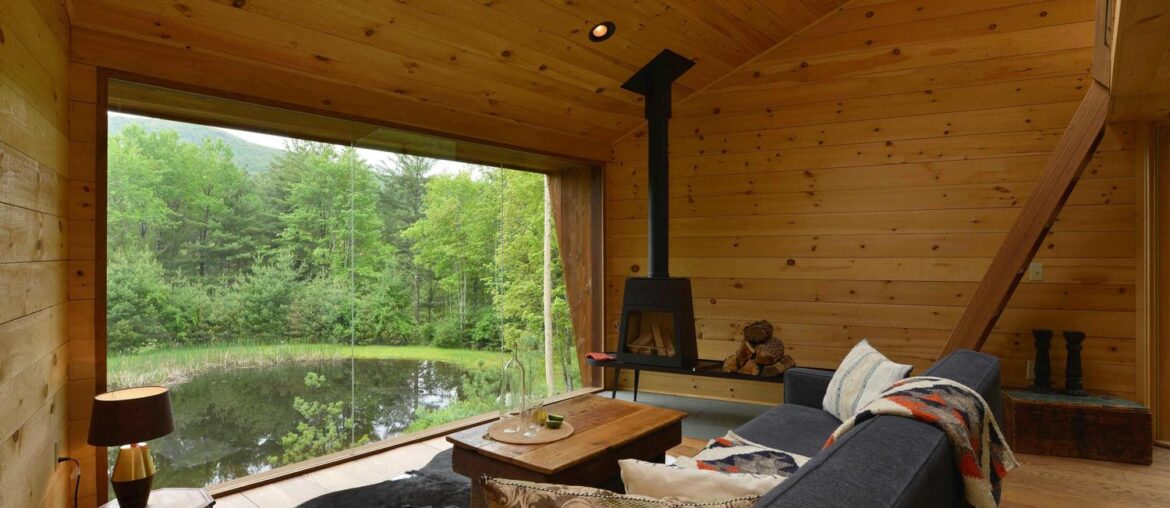 Wood panelled living room overlooking lake [1500 x 1000] Woodstock, New York, America