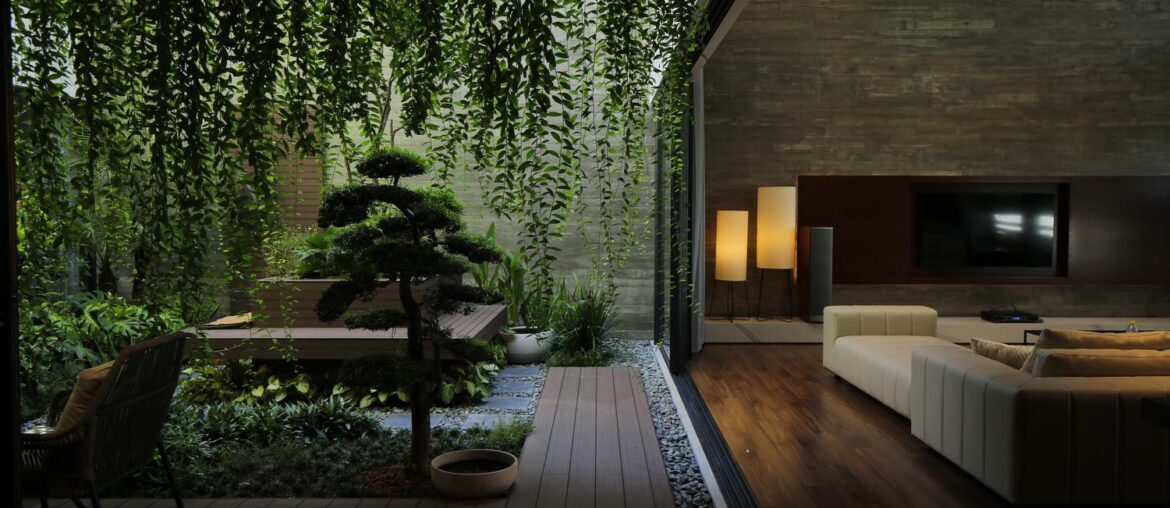 Dark theme living room with green courtyard [1500 x 1000] Vietnam