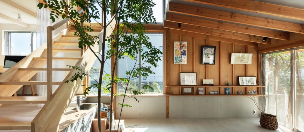 Japanese architect Kohei Yukawa has designed a house for himself and his family in a suburb of Osaka, featuring flexible living spaces arranged around a double-height atrium with a tree at its centre. [2364x1330]