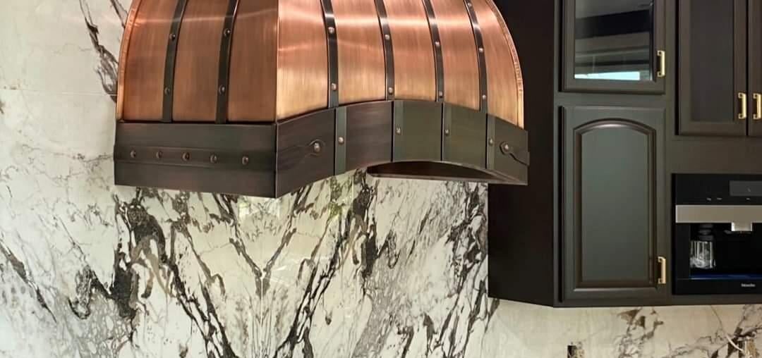 Wanted to show off this range hood my guys did- she's an absolute beaut.