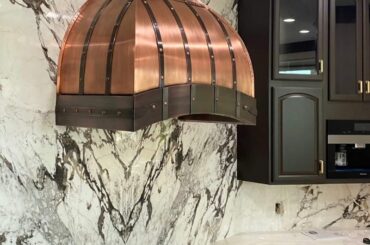 Wanted to show off this range hood my guys did- she's an absolute beaut.