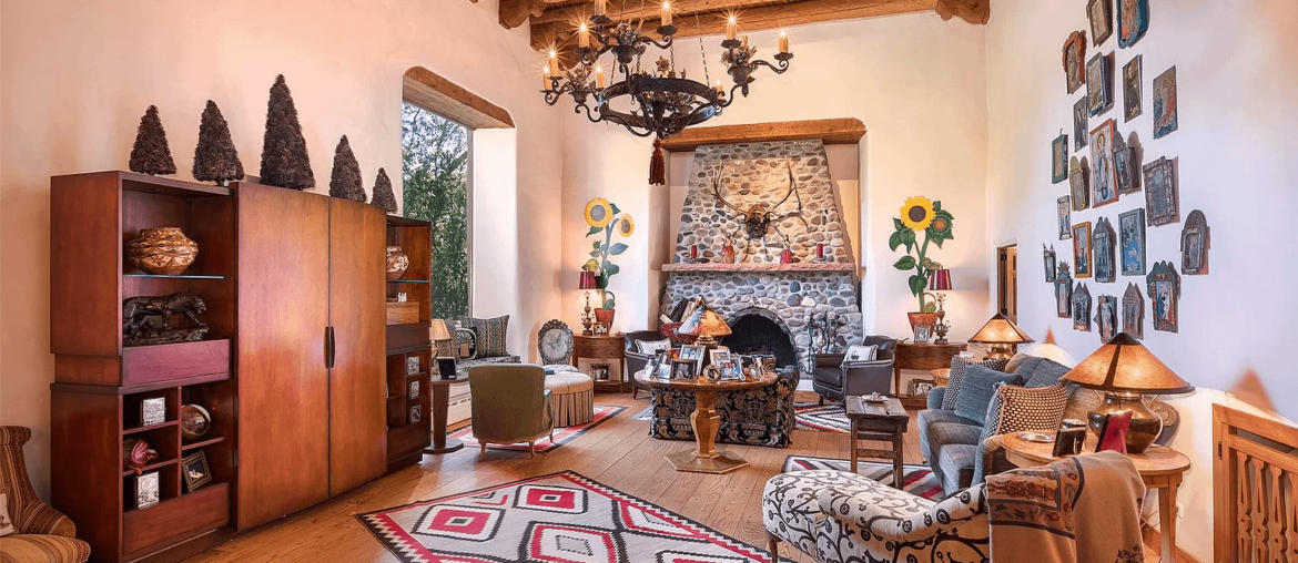 Santa Fe residence great room with sunflower frescos adorning traditional adobe and plaster walls. [1536x1024]
