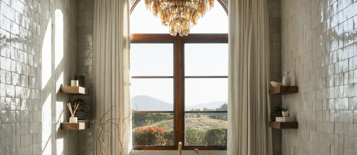 Renovated bathtub nook clad with white zellige tiles, California [2500x3125]