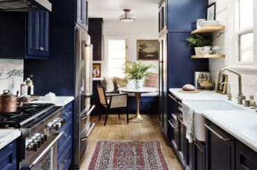 Galley kitchen with a breakfast nook in a gut-renovated circa-1932 Spanish Revival house, West Hollywood, Los Angeles County, California [1080x1350]