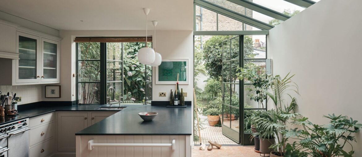 Greenhouse-like kitchen and dining space extension added to a Victorian house, Camberwell, South London, UK [1680x1119]