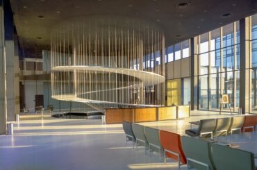 June 1, 1959: The "floating" spiral staircase inside Building 2 at the Convair Astronautics (General Dynamics) plant in Kearney Mesa, California. [2568 X 2000]