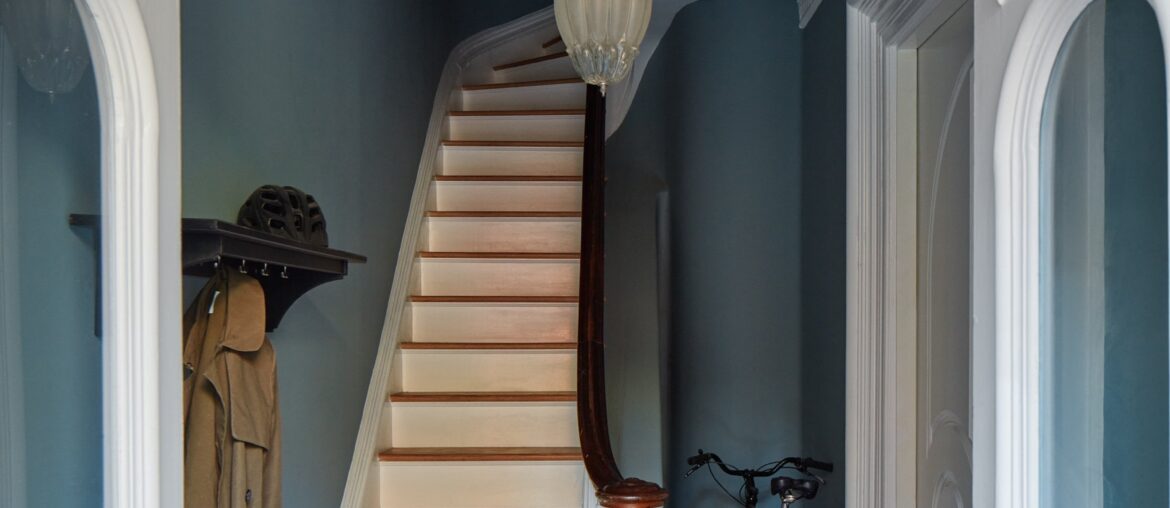Entry hallway with intricate crown molding in a colorfully renovated Fort Greene townhouse, Brooklyn, New York City [2000x2795]