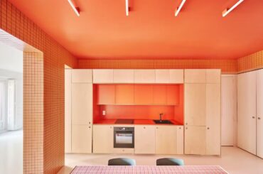 Kitchen in a renovated apartment in Madrid, featuring orange tiles and ceiling [1440x1177]