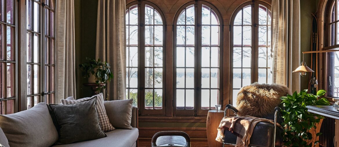 Restored and renovated 1935 Tudor Revival residence on Medicine Lake with well-preserved woodwork, including vaulted timber ceilings and arched windows and doorways, located in Plymouth near Minneapolis, Minnesota [5007x6259]
