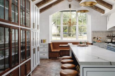 Cathedral ceiling kitchen with exposed beams and a breakfast nook in a Austin residence, Texas [2500x3333]