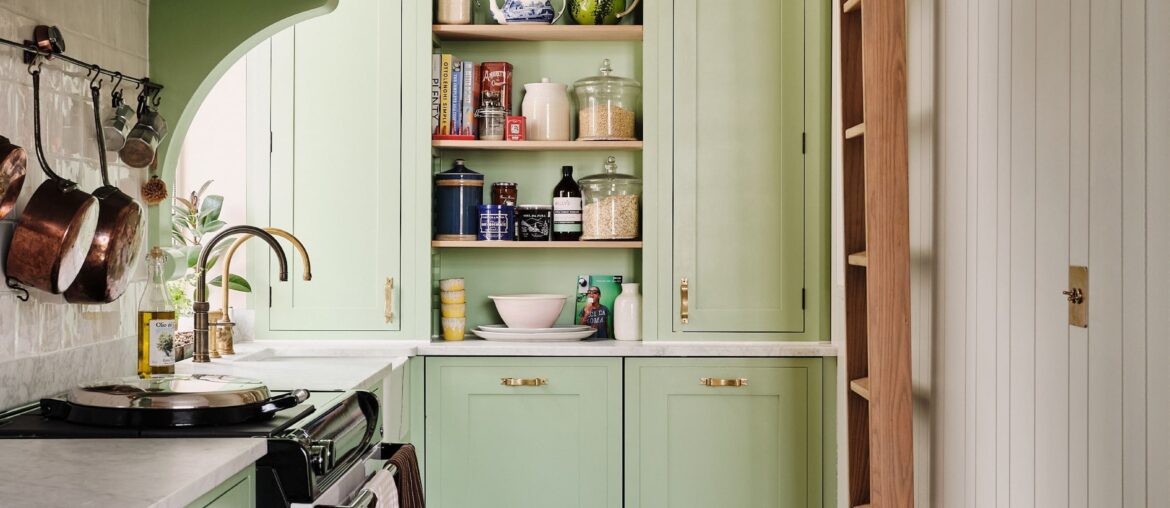 Light green kitchen with floor-to-ceiling cabinets in a renovated Notting Hill flat, West London, UK [2100x2800]