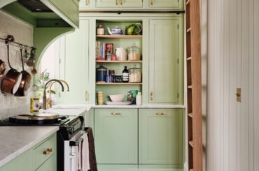Light green kitchen with floor-to-ceiling cabinets in a renovated Notting Hill flat, West London, UK [2100x2800]