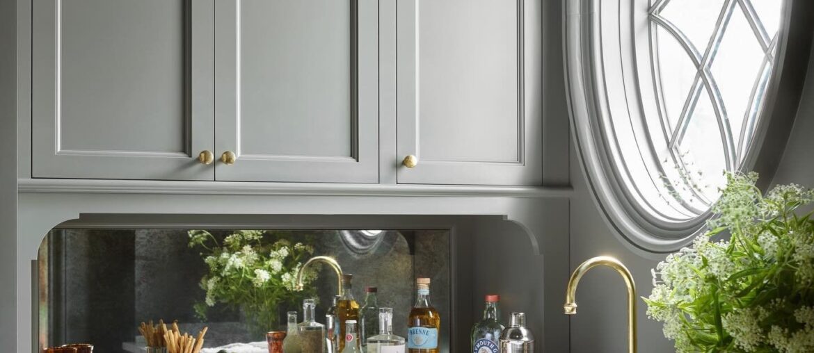 Butler's pantry with an antique mirror backsplash and a circular window in a new Atlanta home, Georgia [1440x1800]