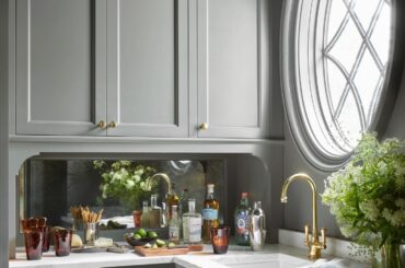 Butler's pantry with an antique mirror backsplash and a circular window in a new Atlanta home, Georgia [1440x1800]