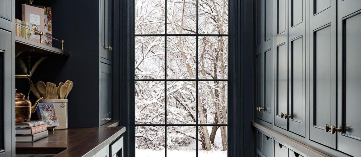 Butler's pantry with dark shaker cabinets and a view of the outdoors in a Utah home [1776x2400]