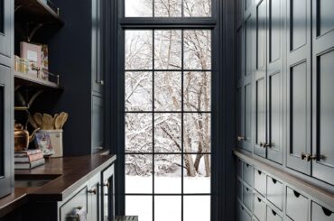 Butler's pantry with dark shaker cabinets and a view of the outdoors in a Utah home [1776x2400]